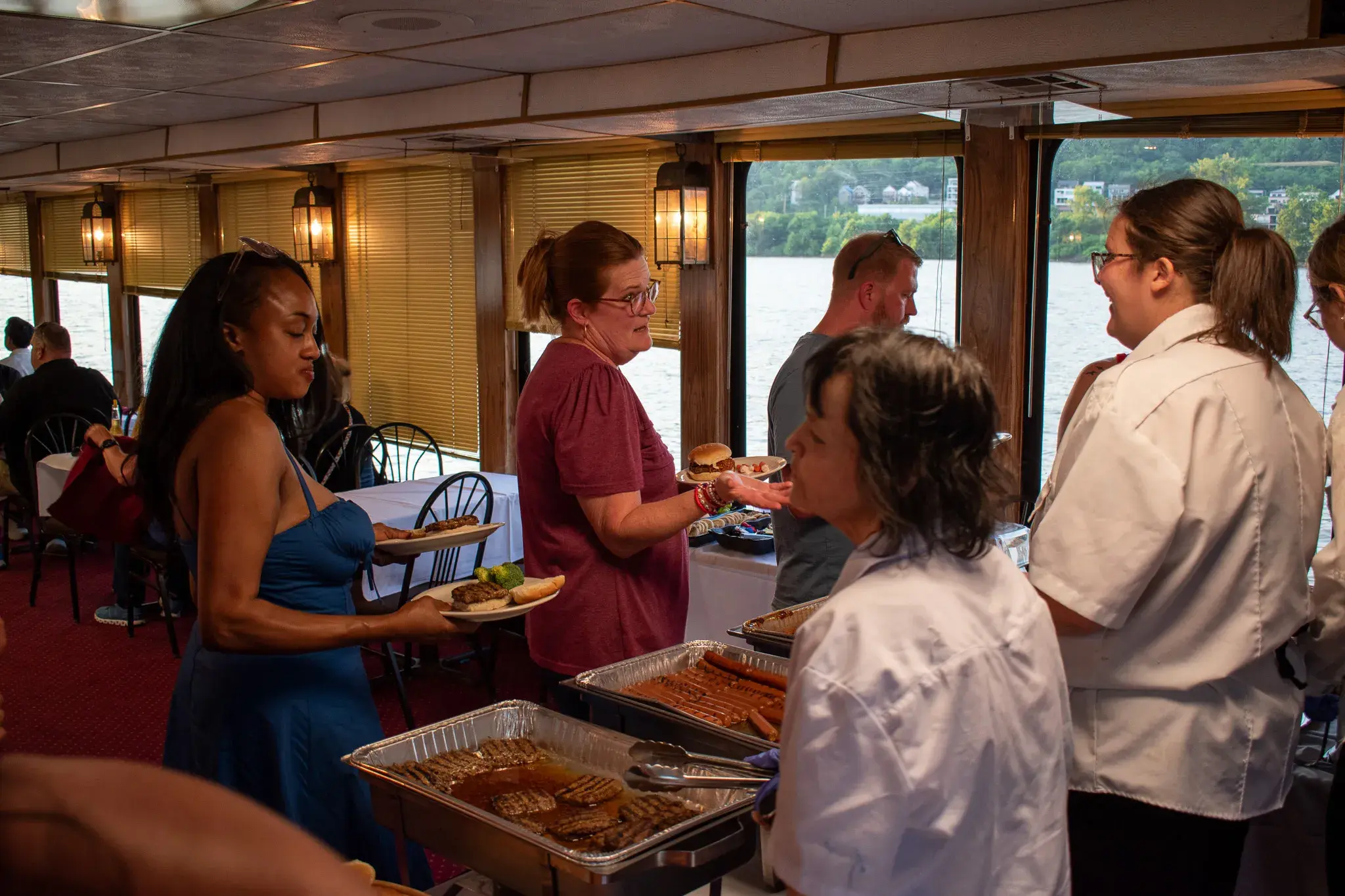 Buffet service on the enclosed dining deck with the Ohio River through the windows