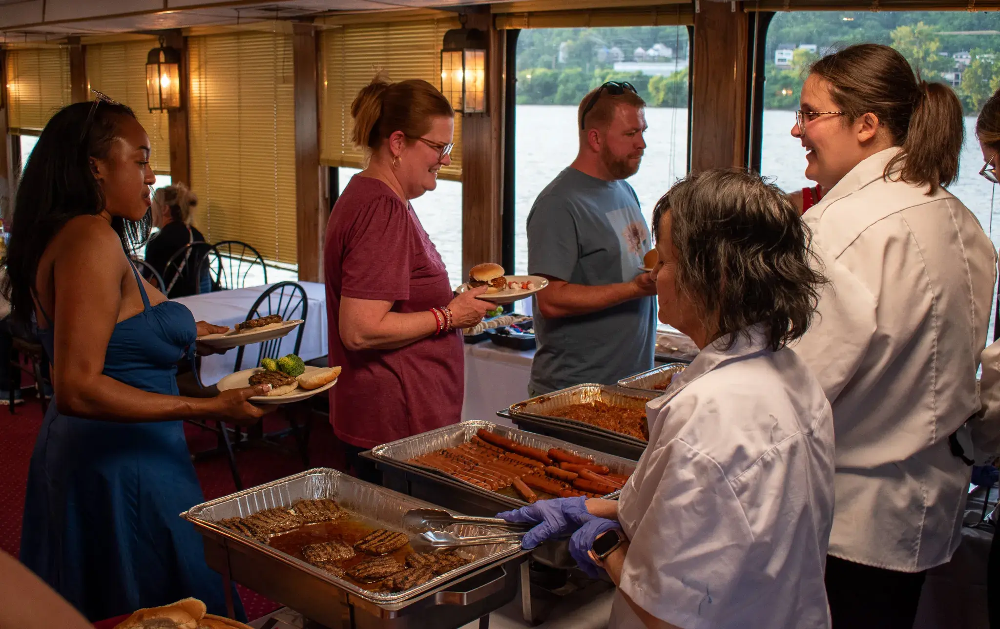 Catering staff serving the buffet line aboard the Spirit of Cincinnati