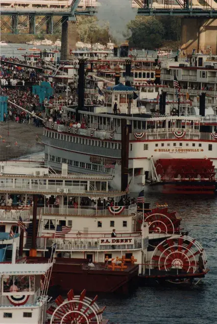 The Belle of Louisville and P.A. Denny moored at Cincinnati's Public Landing for Tall Stacks 1992, crowds along the bank