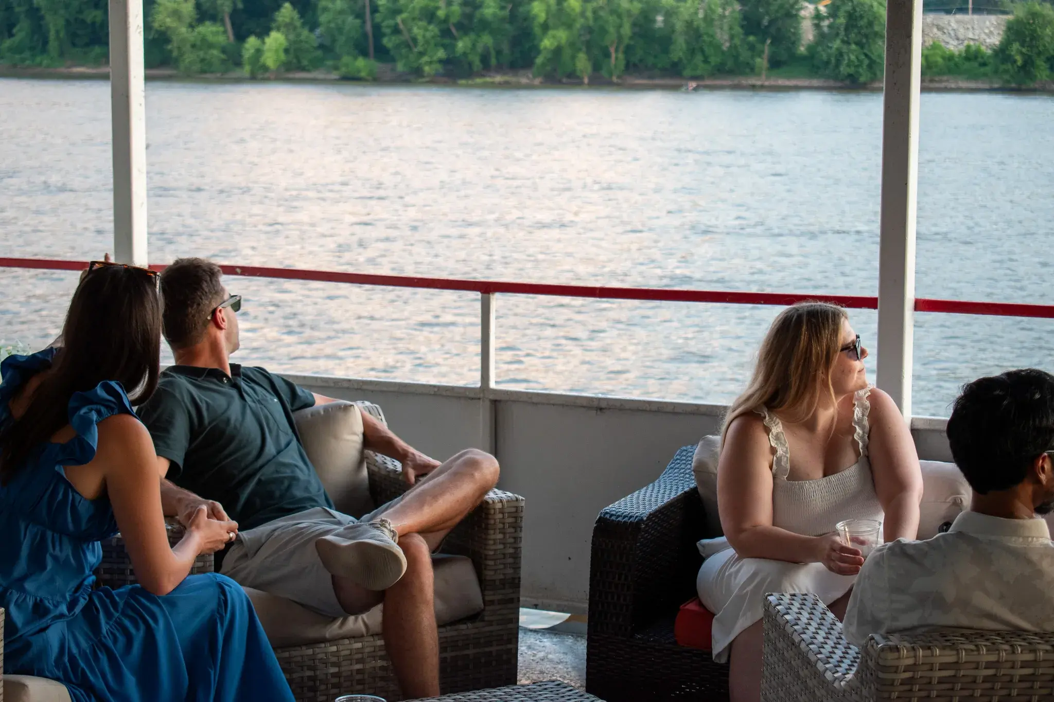 Open-air top deck lounge seating with views of the Ohio River